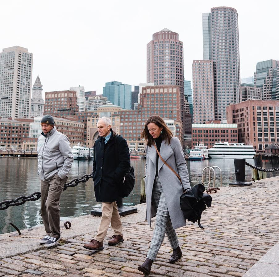 Students walking in Boston by water